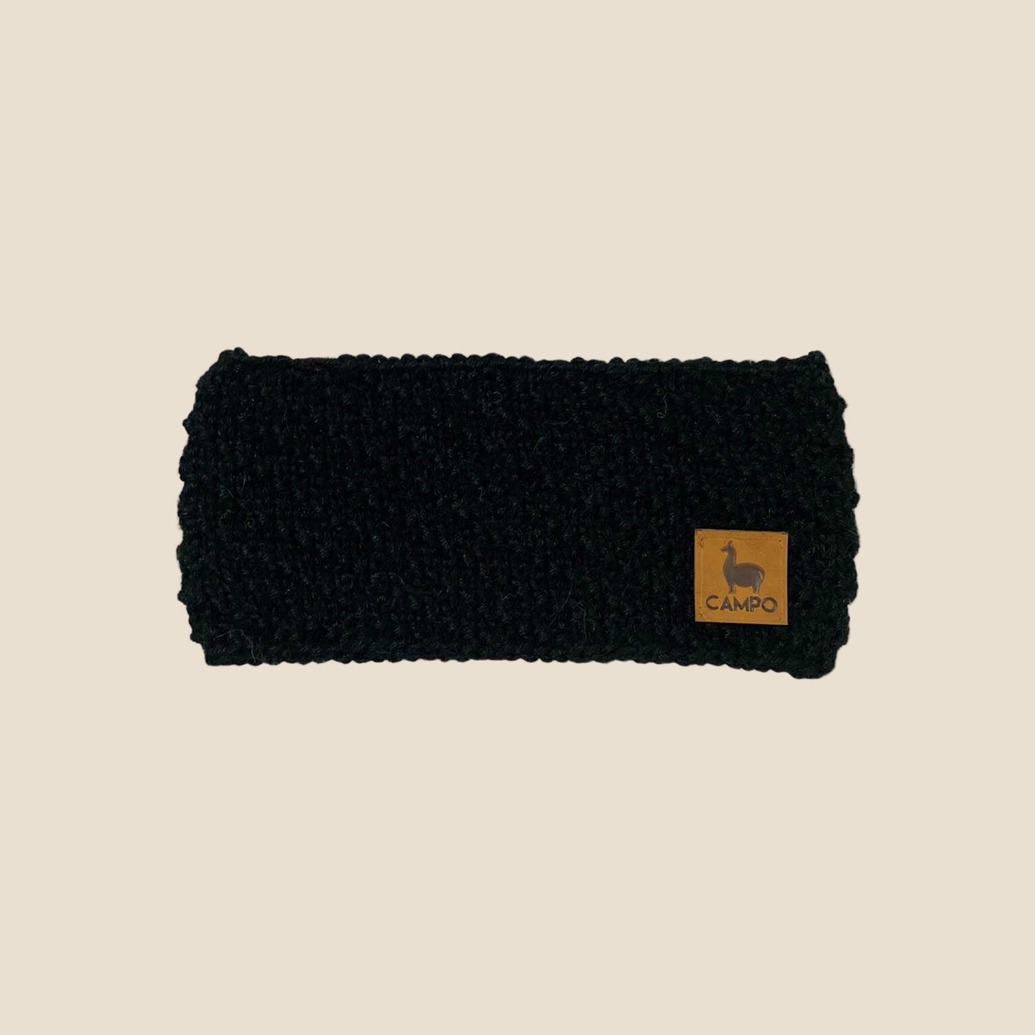 Black knitted headband with a brand logo on a white background