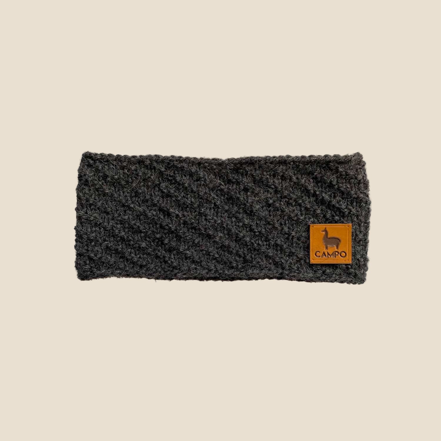 Dark gray knitted headband with a brown logo on a white background