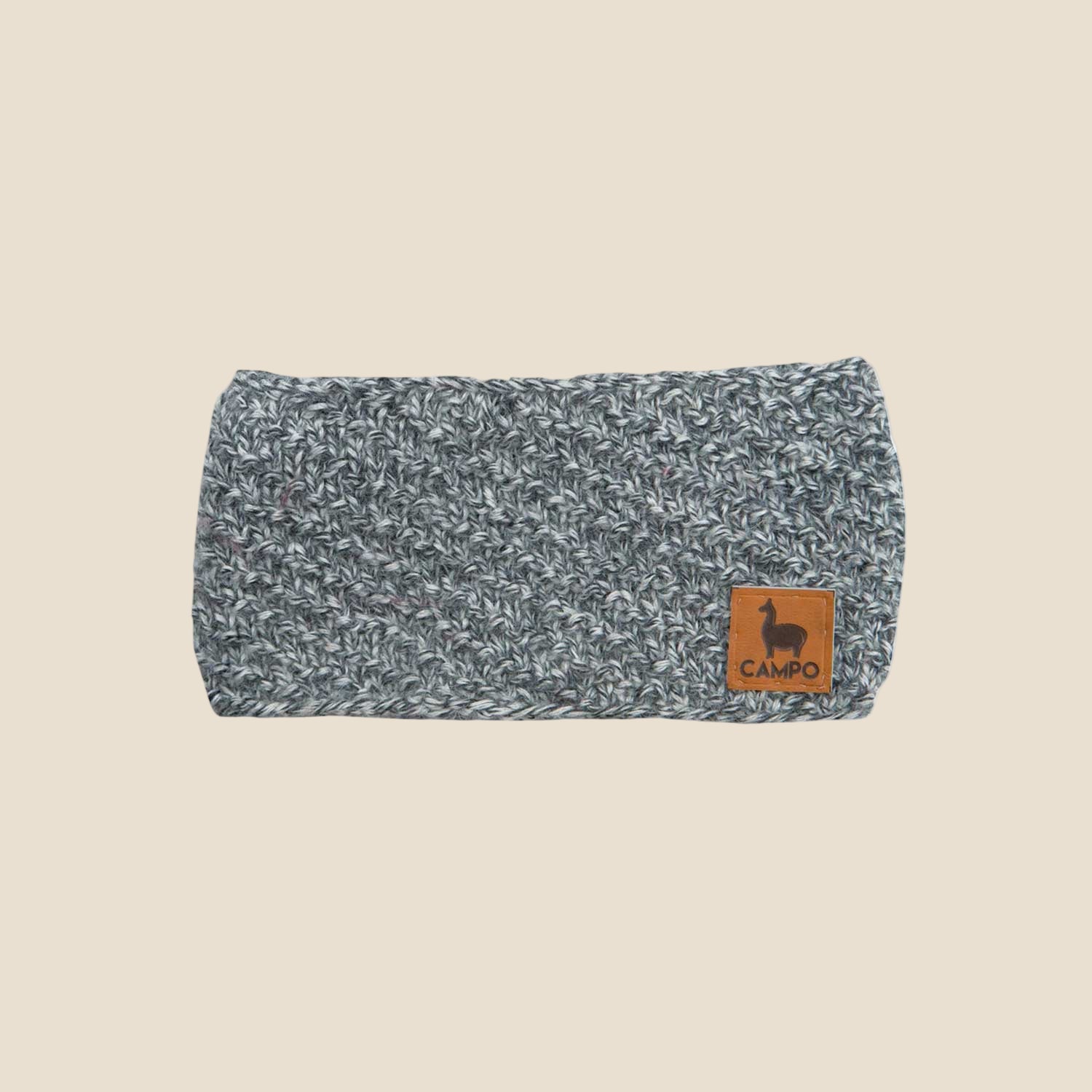 Gray knitted headband with a brown label on a white background