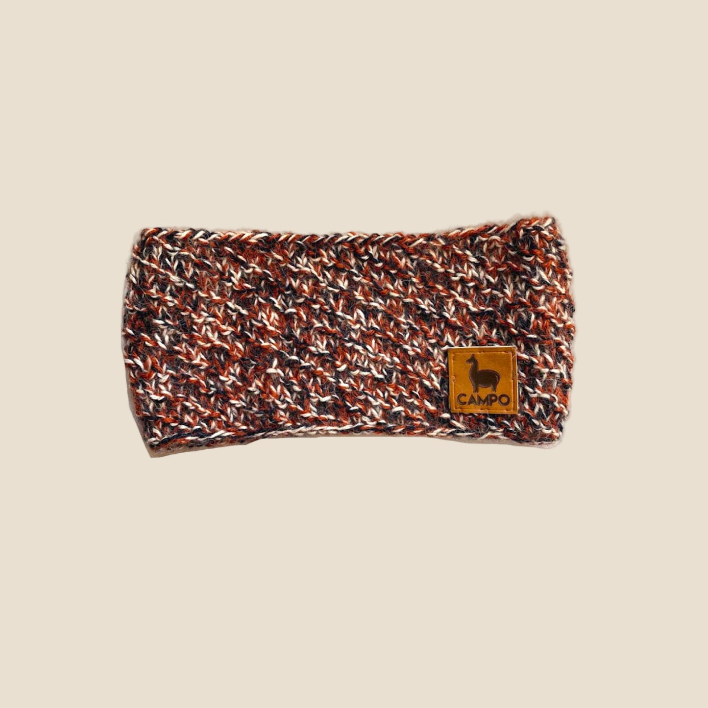 Knitted headband with a brand logo on a white background