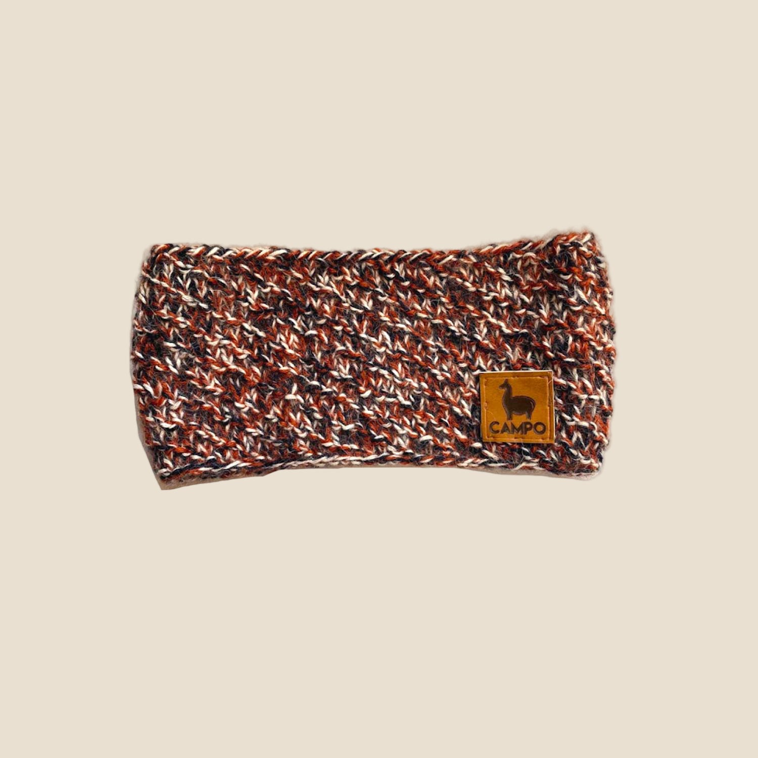 Knitted headband with a brand logo on a white background