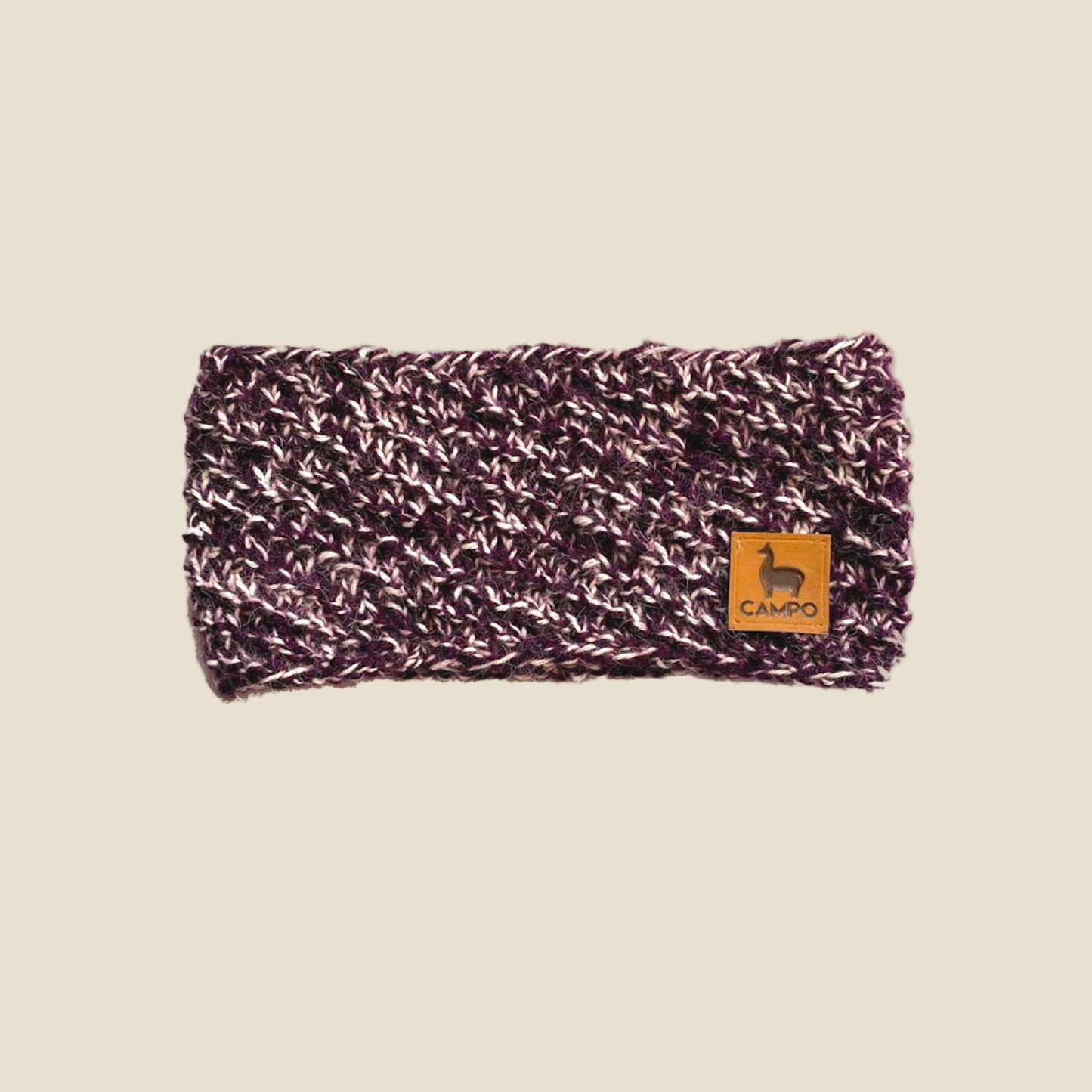 Knitted headband with a visible brand logo on a white background