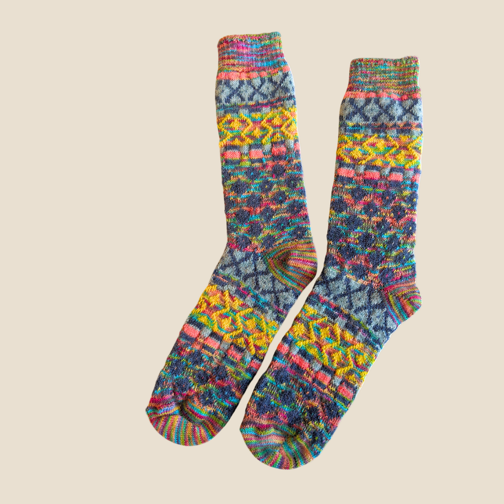 Colorful patterned socks on a beige background