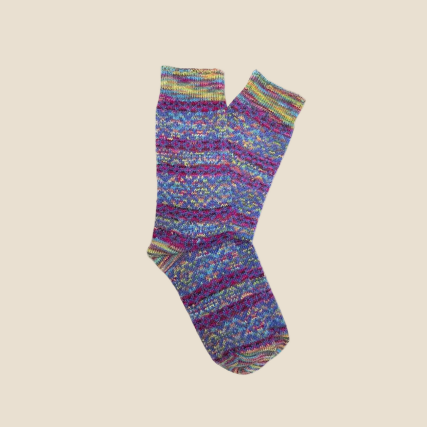 Colorful knitted sock on a beige background