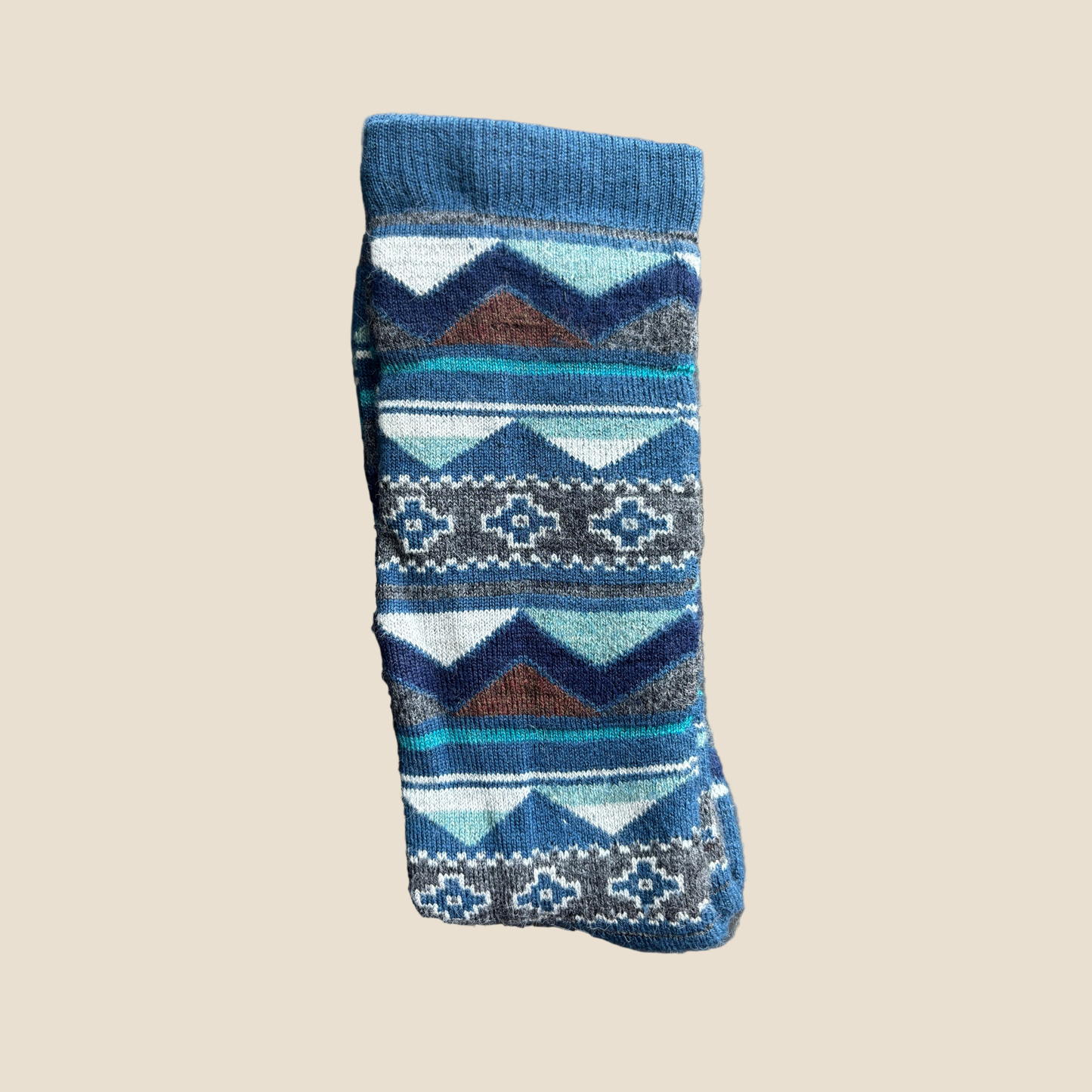 Knitted sock with a pattern on a beige background