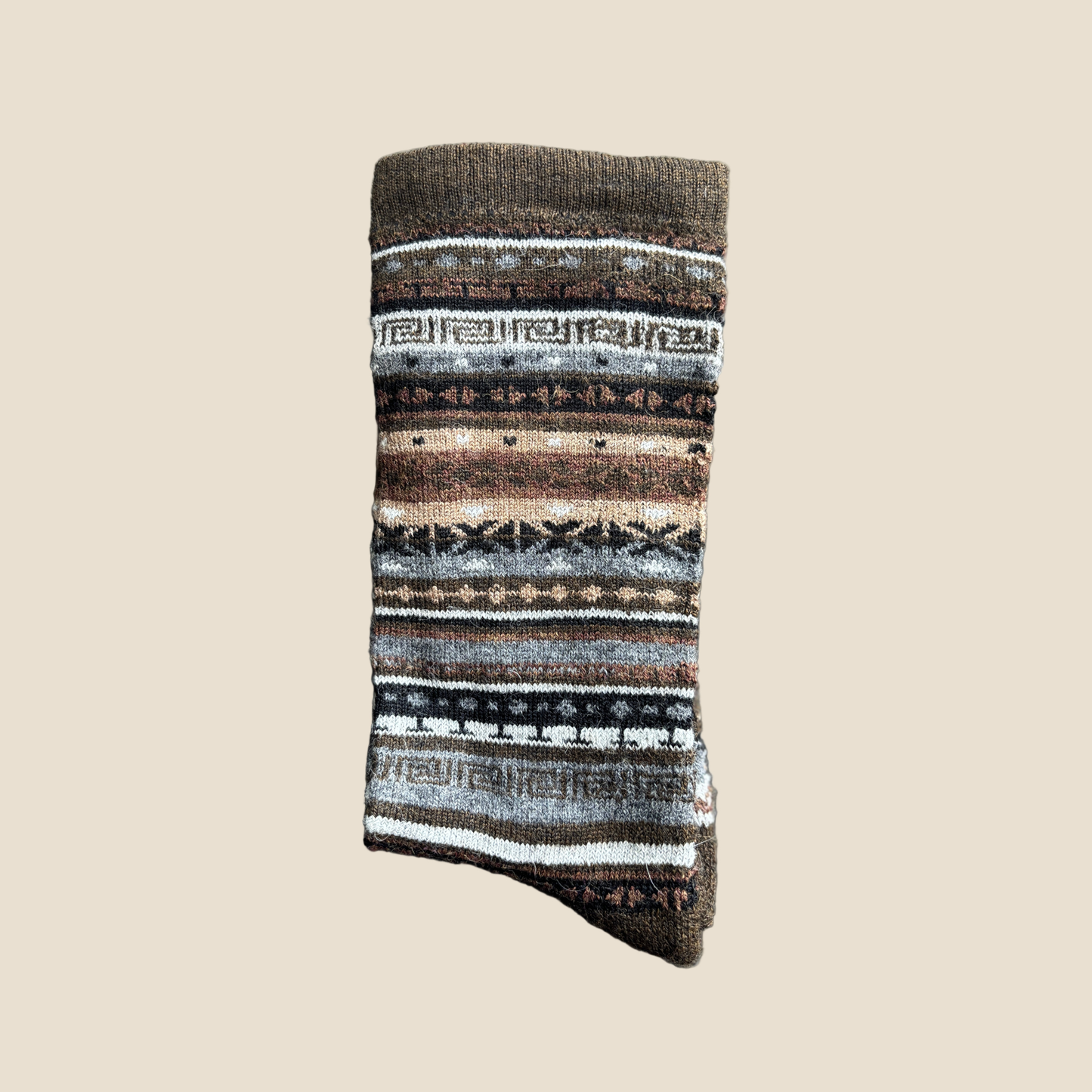 Knitted sock with a pattern on a beige background