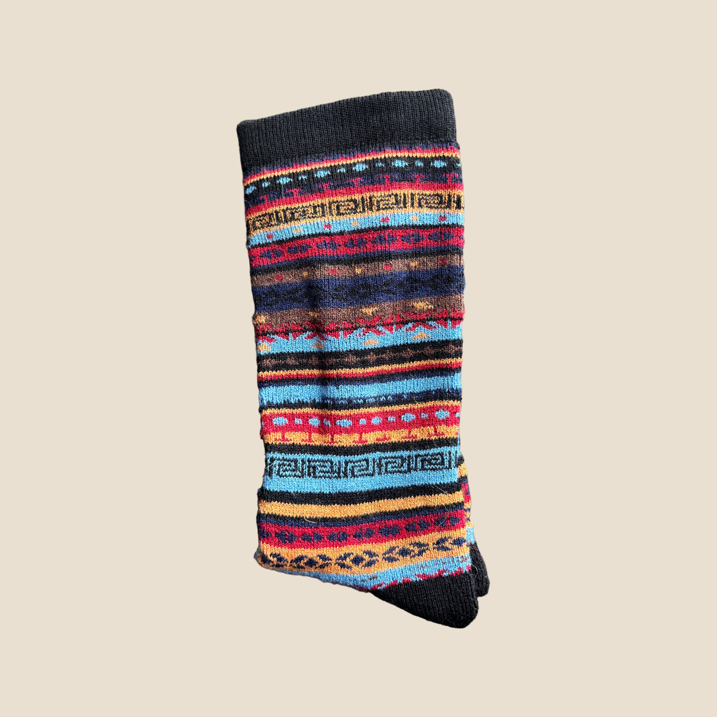 Colorful striped sock on a beige background