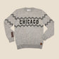 Gray sweater with 'Chicago' text and zigzag pattern on a beige background