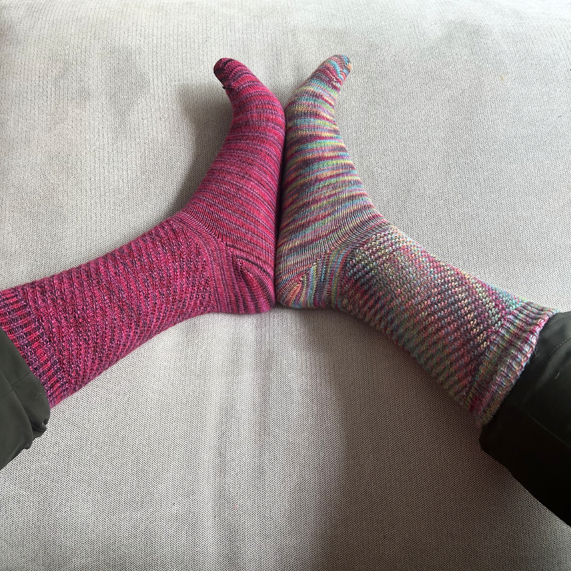 Colorful socks on a light gray surface