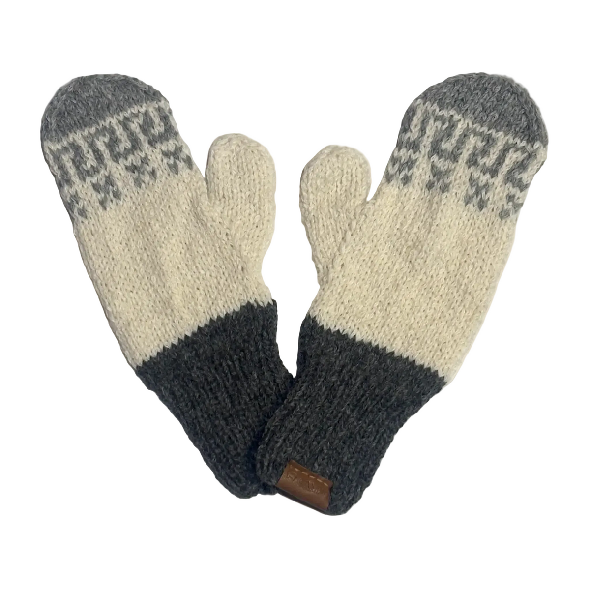 A pair of knit mittens in cream, dark gray, and medium gray, featuring a patterned knit design on the back of the hands and a small brown leather brand tab near the wrist.