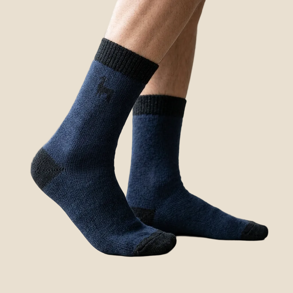 A person wearing dark navy crew socks with black ribbed cuffs and black toe/heel accents, shown standing on a light floor in a bright indoor setting.