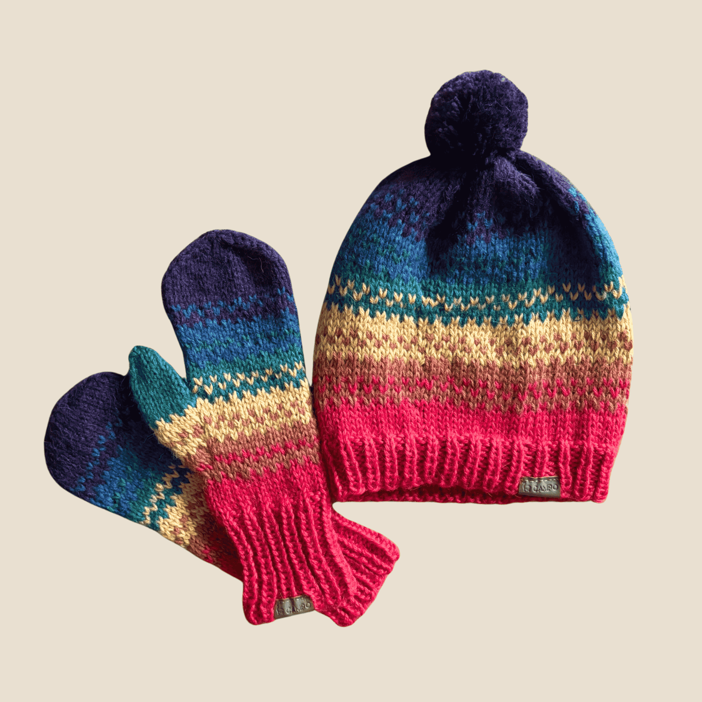 Full view of knitted Rainbow Beanie featuring soft alpaca fibers and cheerful, multicolored stripes