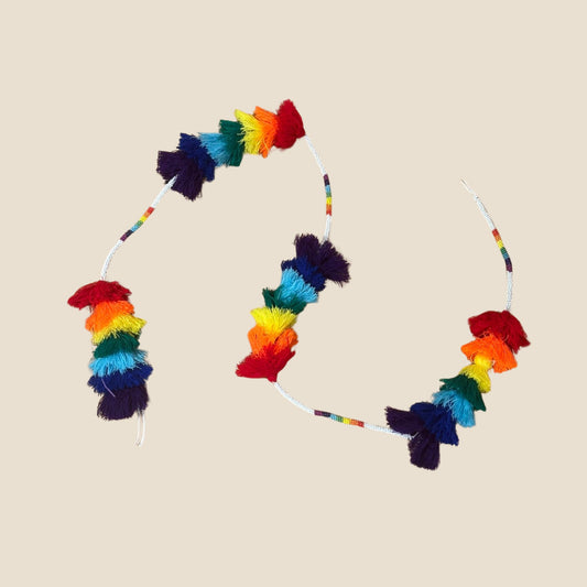 Colorful hoop home decor with rainbow and multicolor design on a beige background