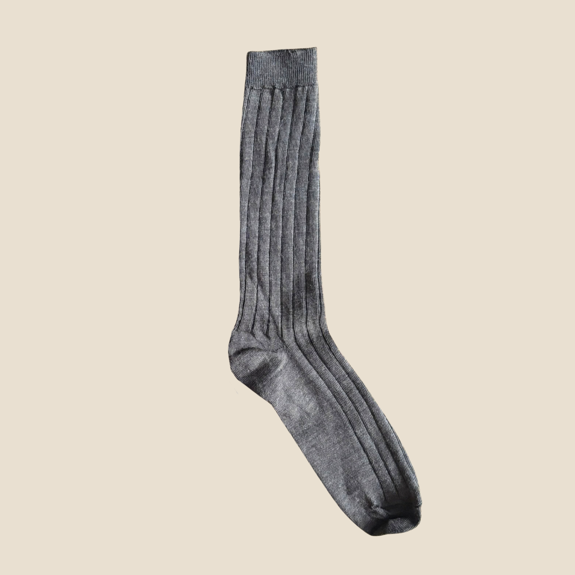 Brown sock on a beige background