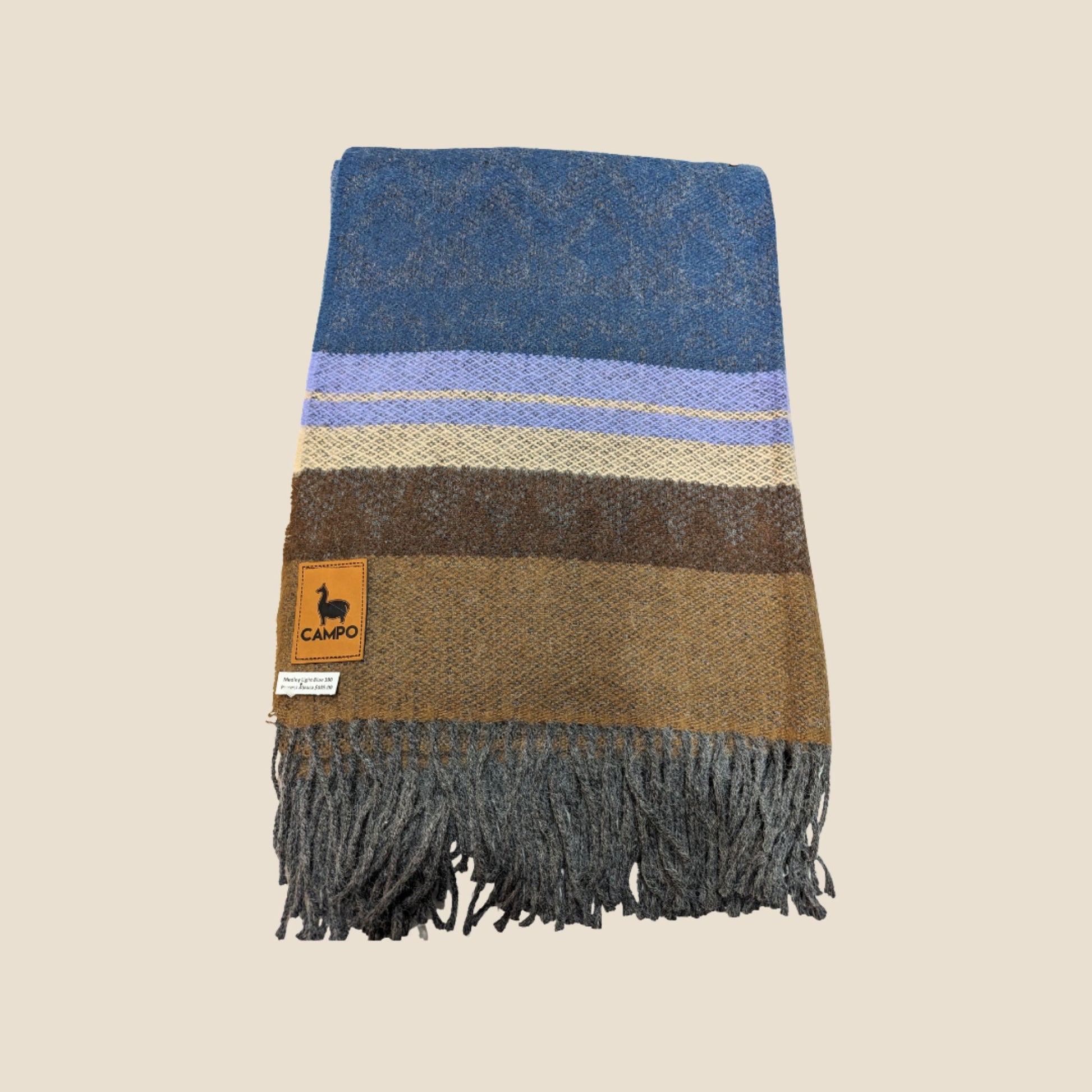 Striped scarf with fringes and a brand logo on a beige background