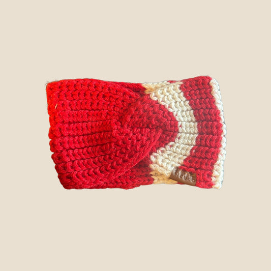 Red and white crocheted headband on a beige background