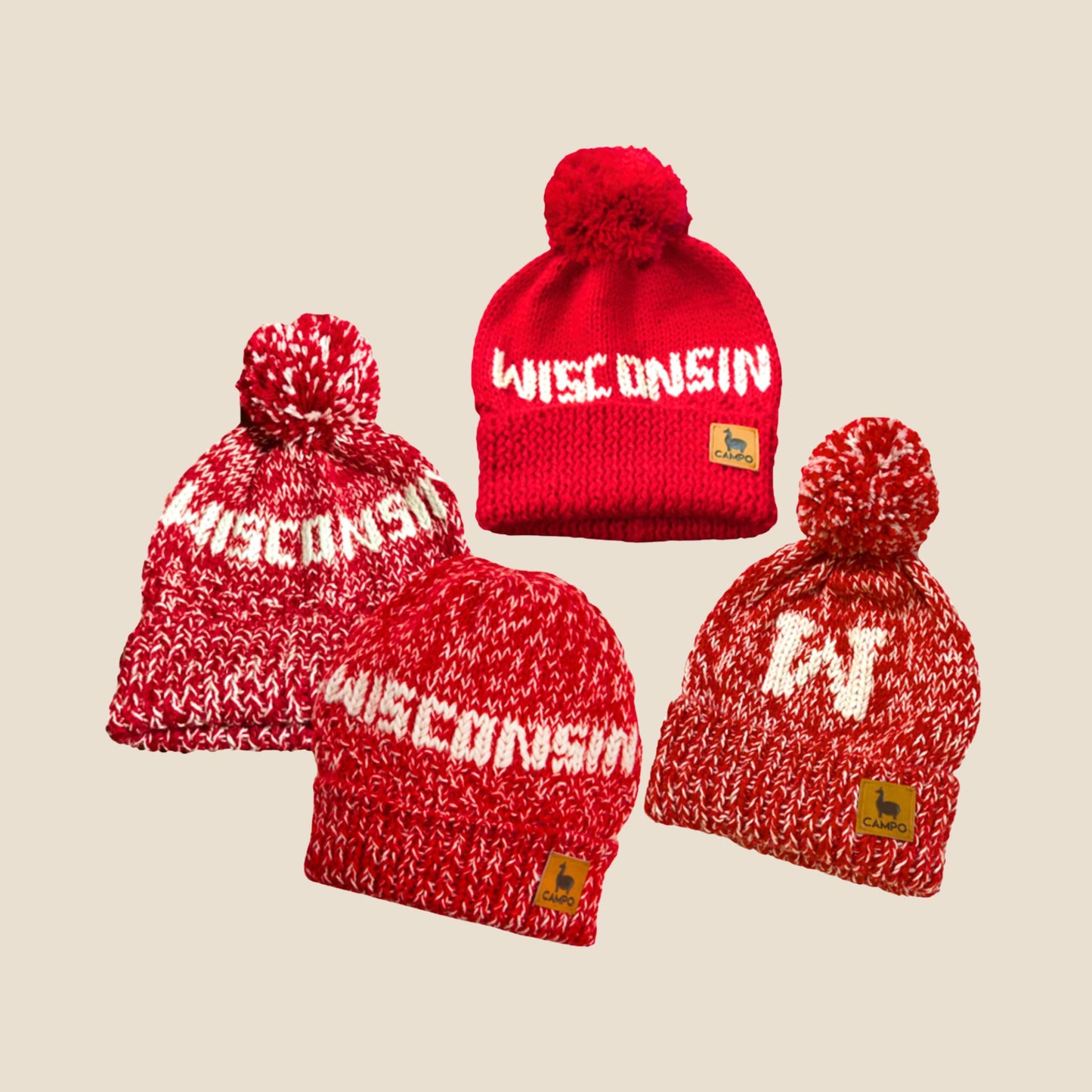 Red and white 'Wisconsin' beanie with pom-poms on a beige background