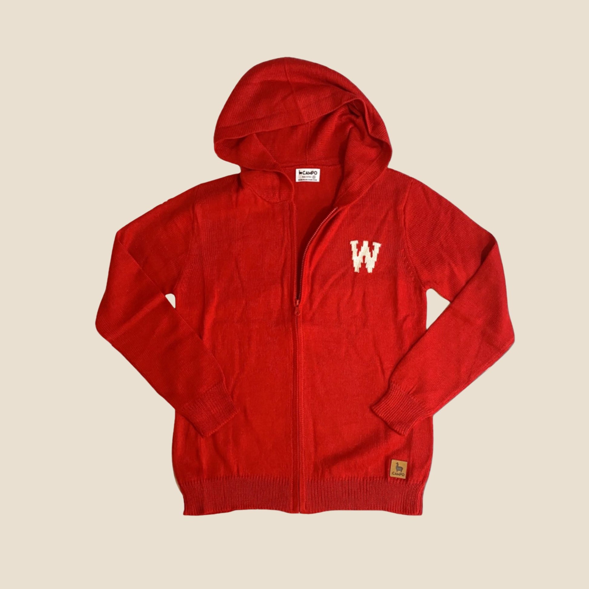 Red hoodie with a logo on a beige background