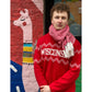 Person wearing a red 'WISCONSIN' sweater with a colorful mural in the background