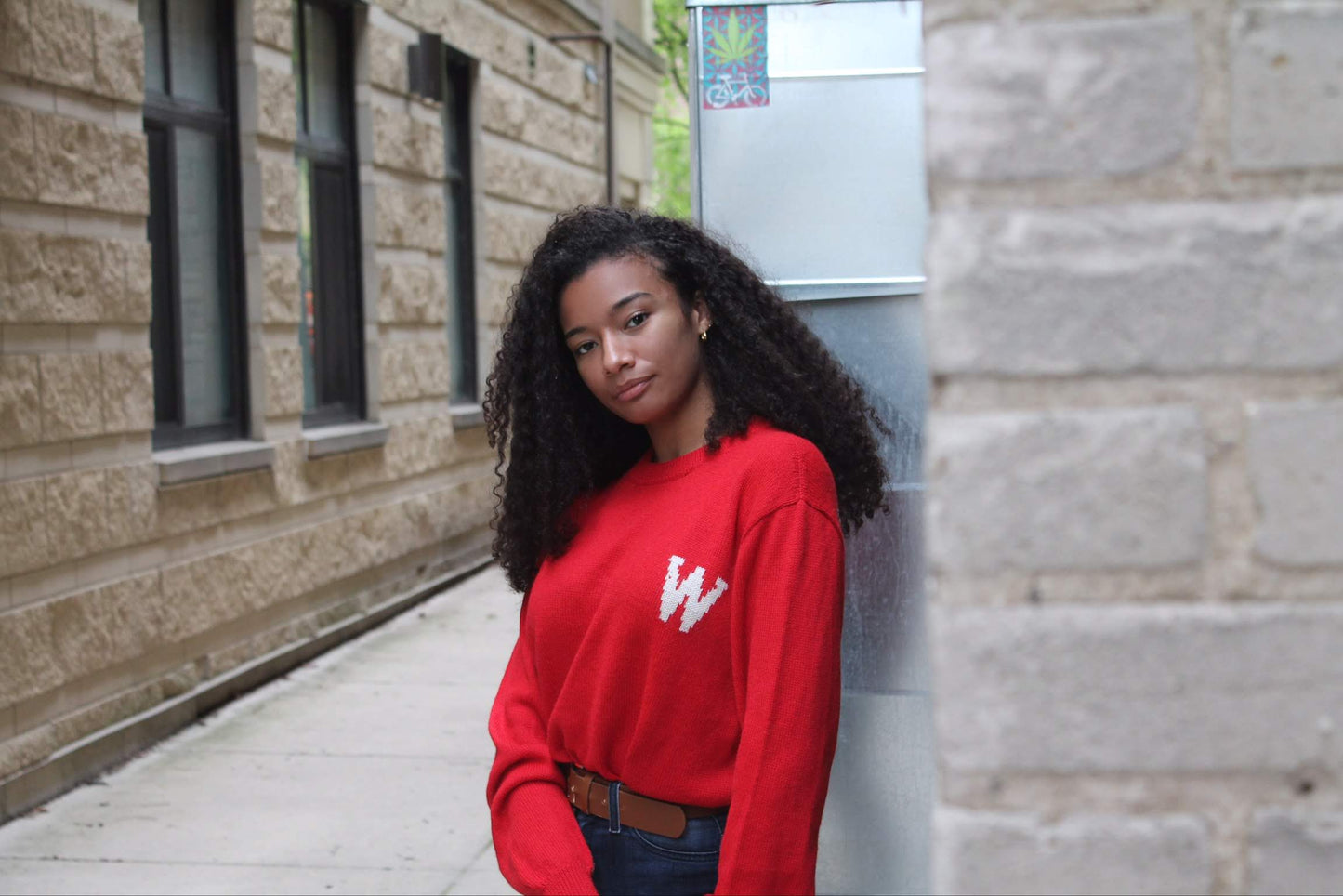 Girl wearing Red W Wisconsin Alpaca Crew Neck Sweater